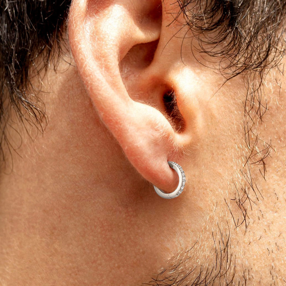 Man wearing Sterling Silver Huggie Hoop Earrings