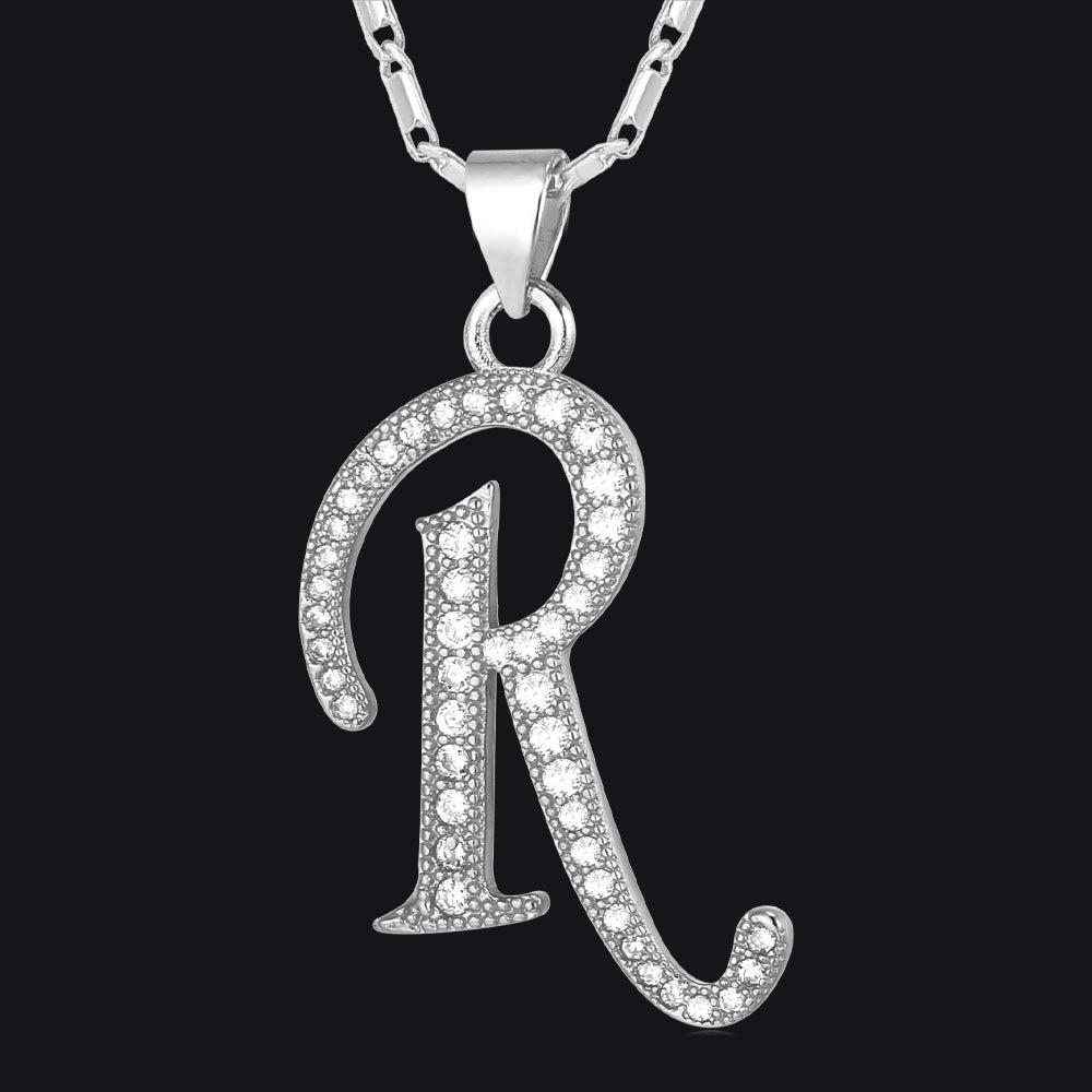 Silver Cubic Zirconia Initials R Necklace with a 'R' pendant on a black background