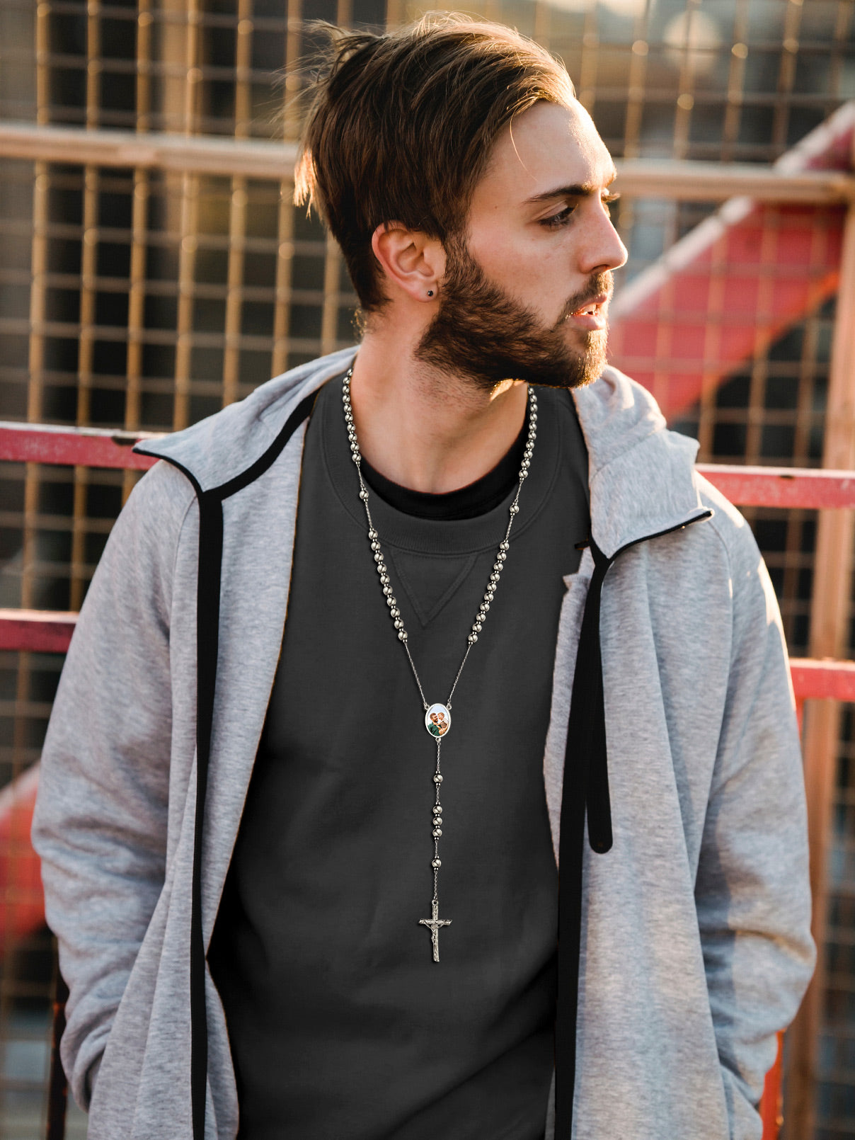 Man wearing custom photo rosary necklace