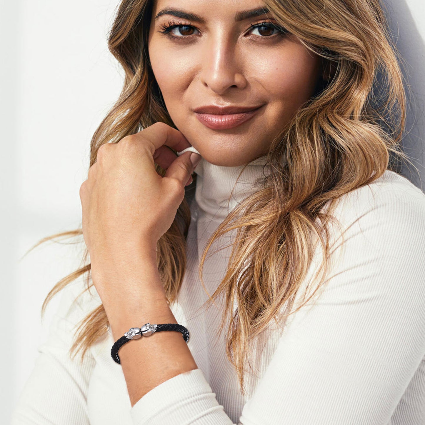 Woman wearing skull bracelet, stylish men's jewelry