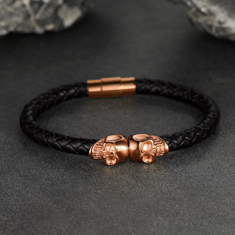 Men's black braided leather bracelet with skull heads