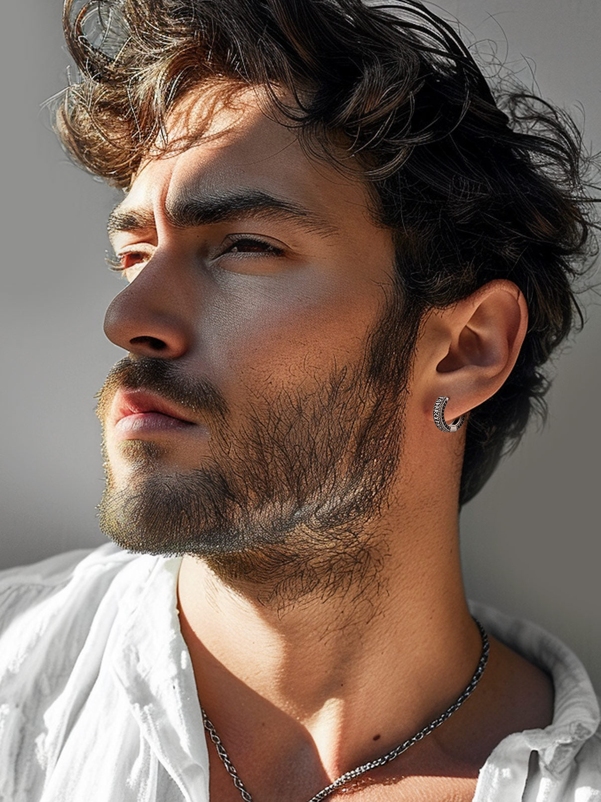 Man wearing Sterling Silver Viking Runes Hoop Earrings