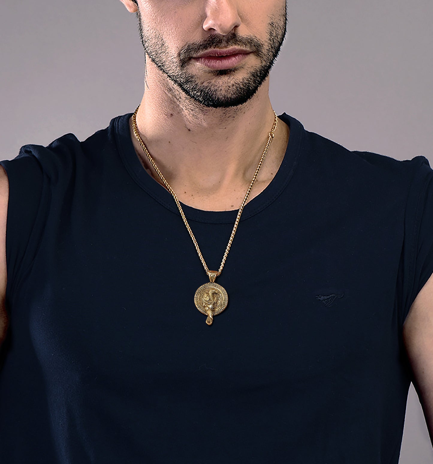 Man wearing gold Viking Odin's Raven pendant necklace