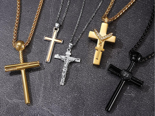 Collection of cross pendants in gold, silver and black finishes