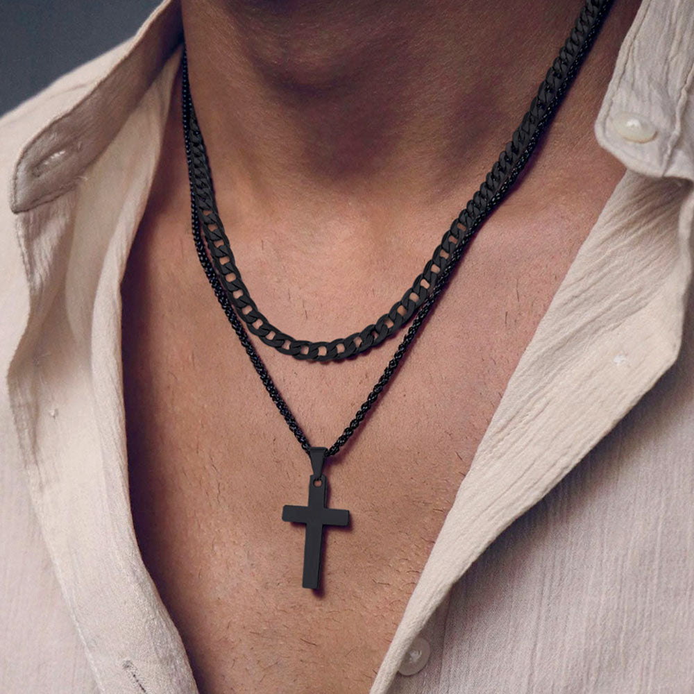 Men wearing a black chain necklace with a cross pendant.