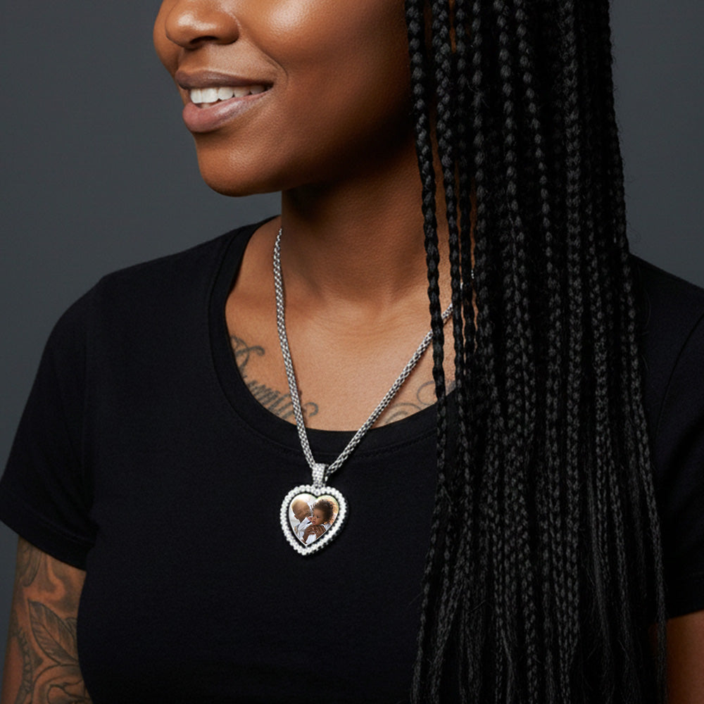Woman wearing a necklace with a heart-shaped pendant featuring an image of a child