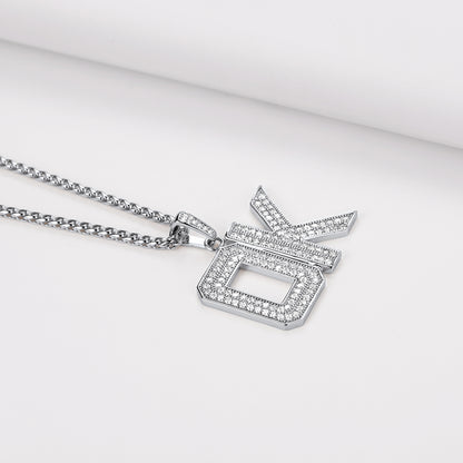 Silver necklace with a star-shaped pendant on a light gray background