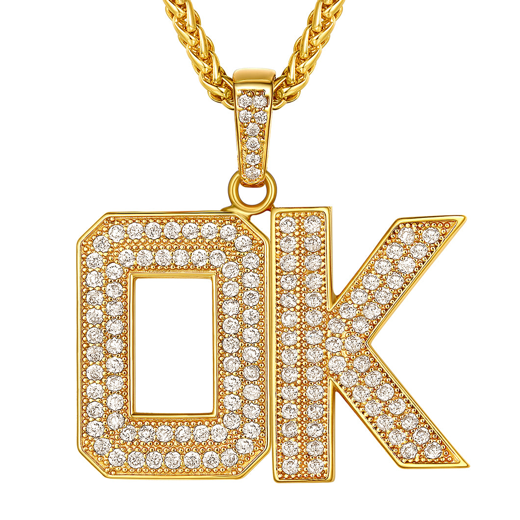 Gold necklace with 'OK' pendant on a white background