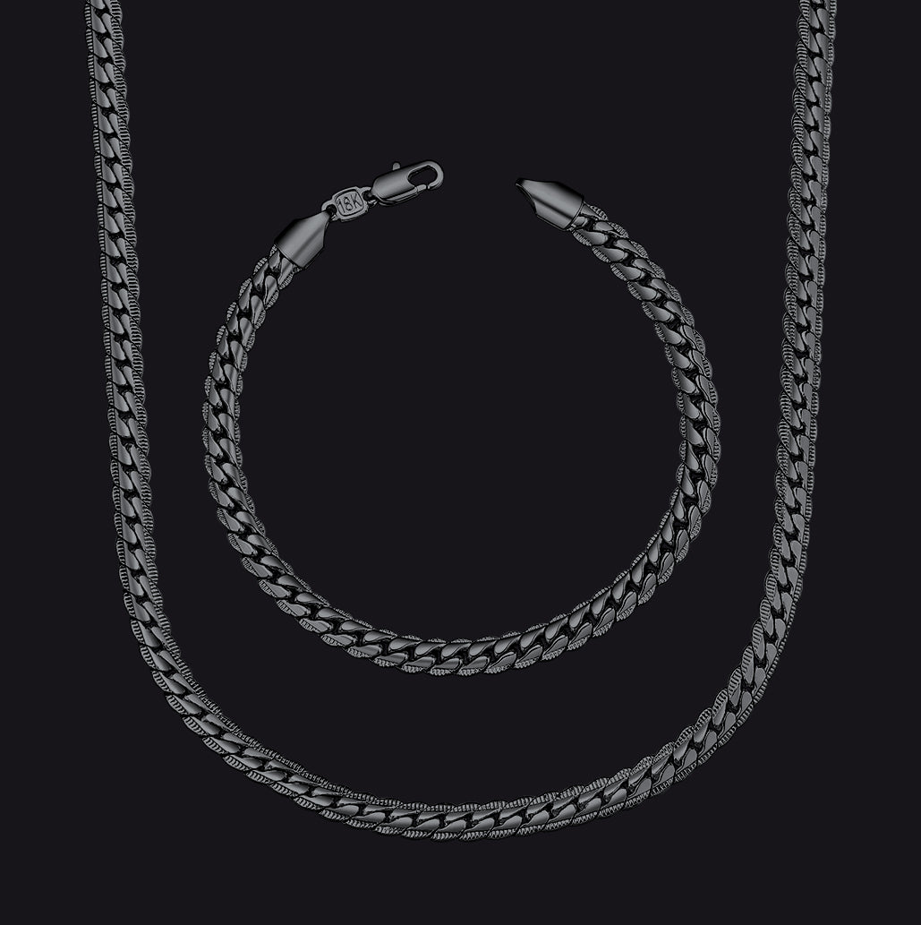 A Black Cuban link chain necklace and matching chain bracelet.