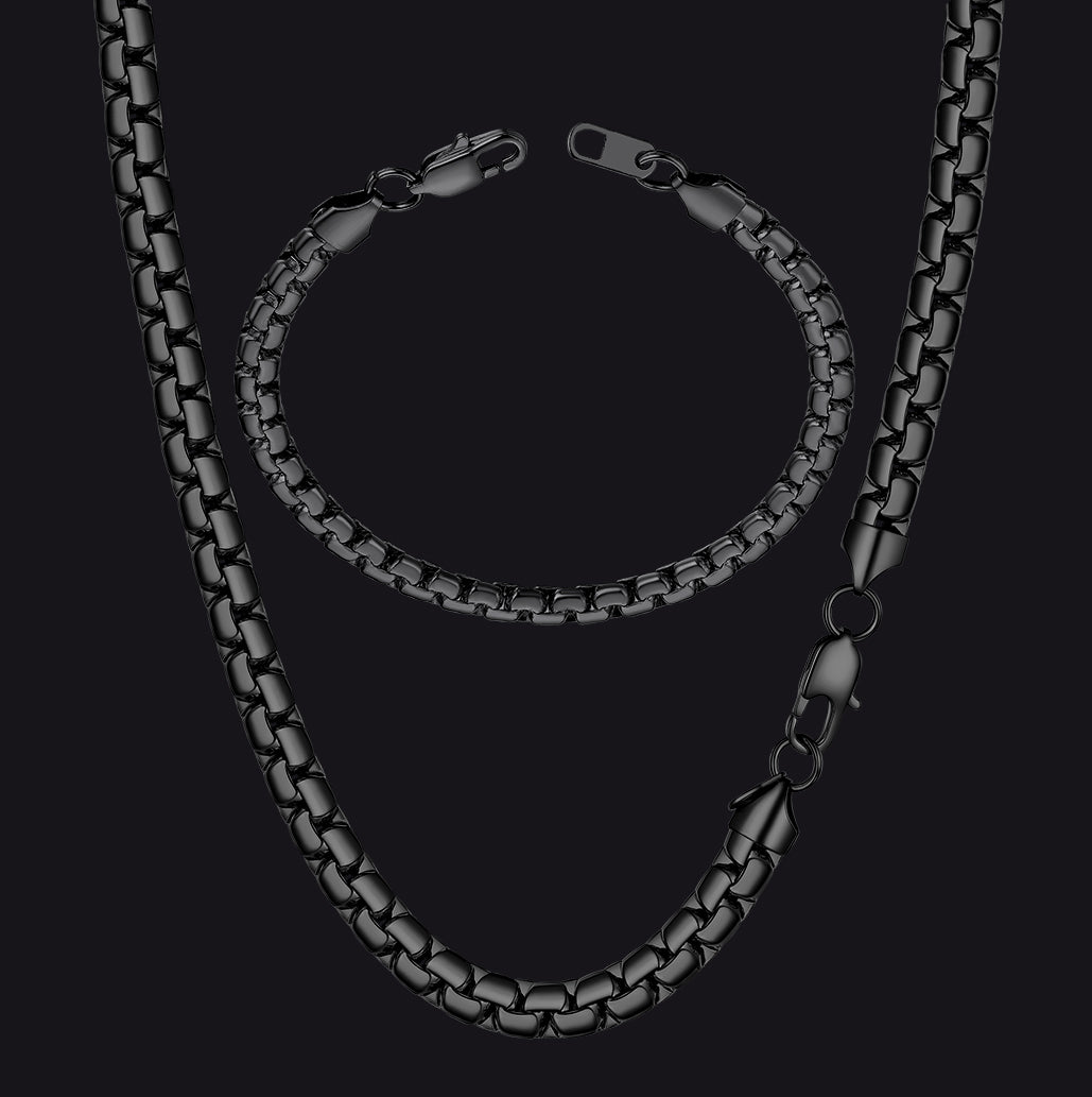Black chain necklace on a black background