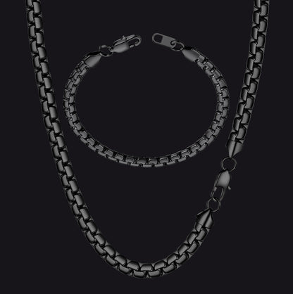 Black chain necklace on a black background