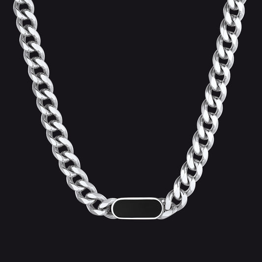 Silver chain necklace with a tag on a black backgroundimg