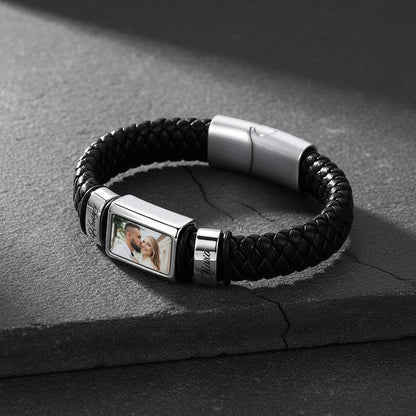 Personalized braided leather bracelet with custom name engraving, flat lay product display