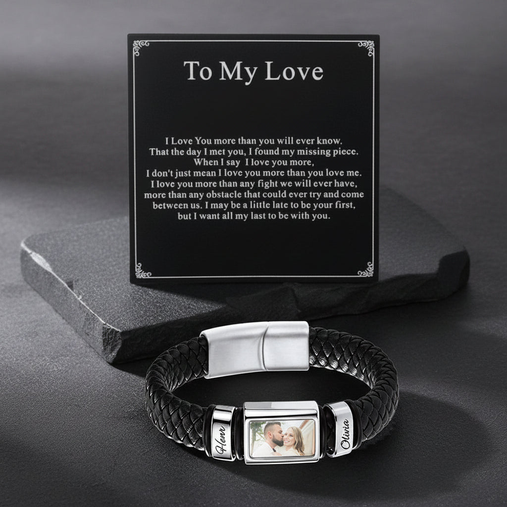 A personalized black braided bracelet with a black card that reads 'To My Love' with a sentimental message.