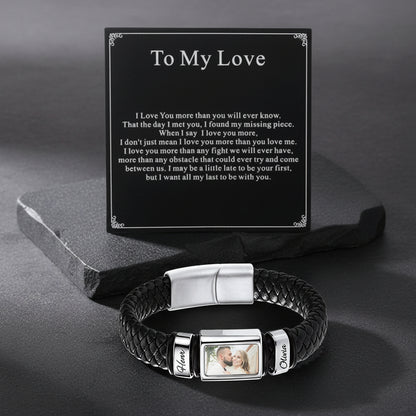 A personalized black braided bracelet with a black card that reads 'To My Love' with a sentimental message.