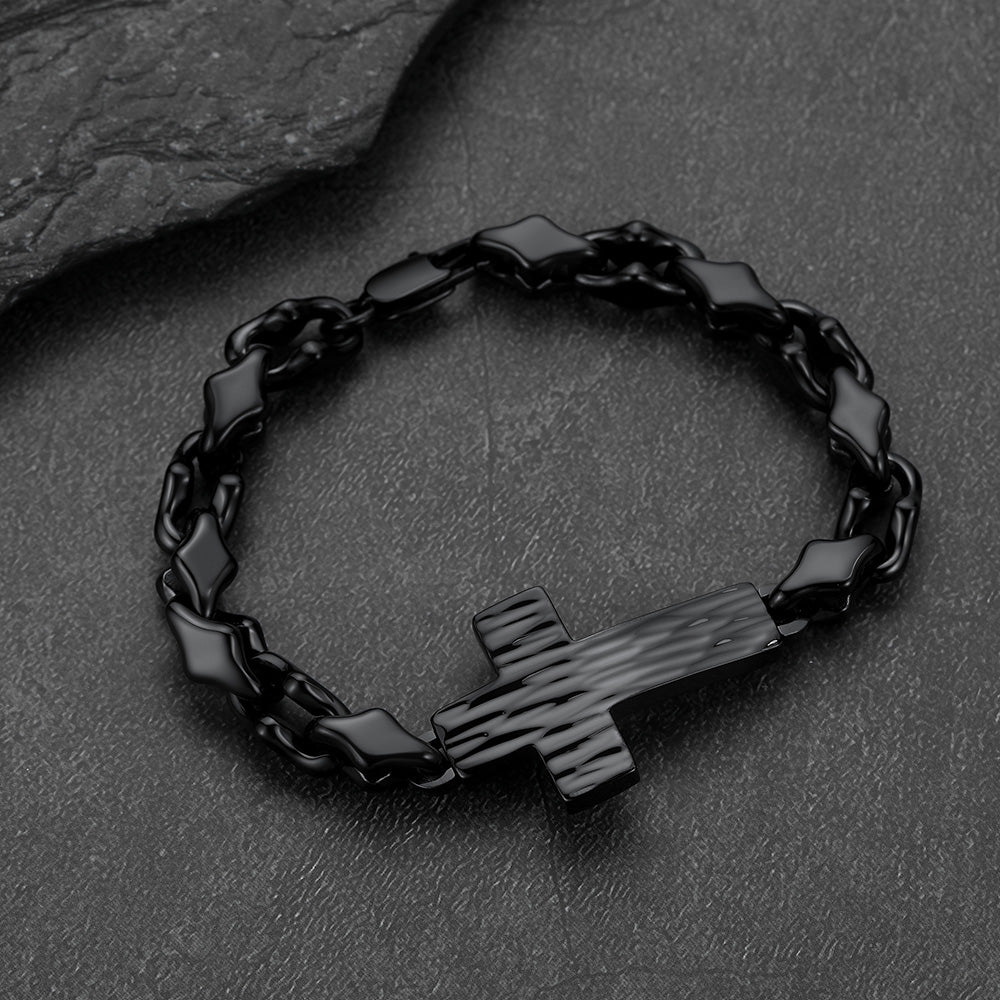 Close-up of black geometric cross diamond cut chain links, detailed gothic bracelet for men