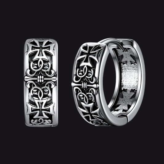 Silver hoop earrings with cross designs on a black backgroundimg