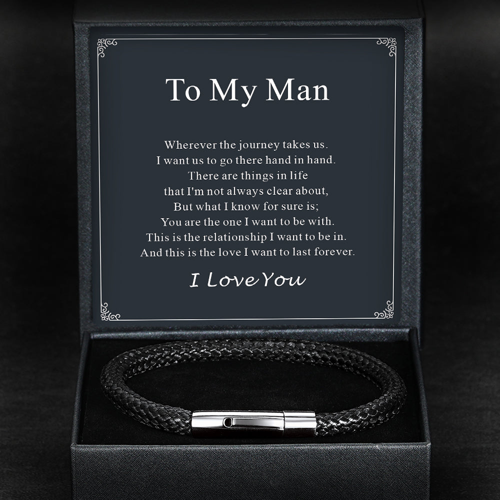 Brown braided leather bracelet with silver clasp in a black box with a sentimental message