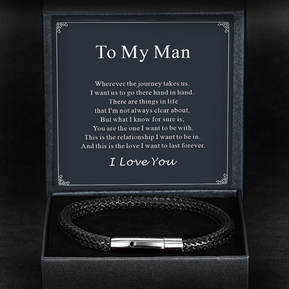 Brown braided leather bracelet with silver clasp in a black box with a sentimental message