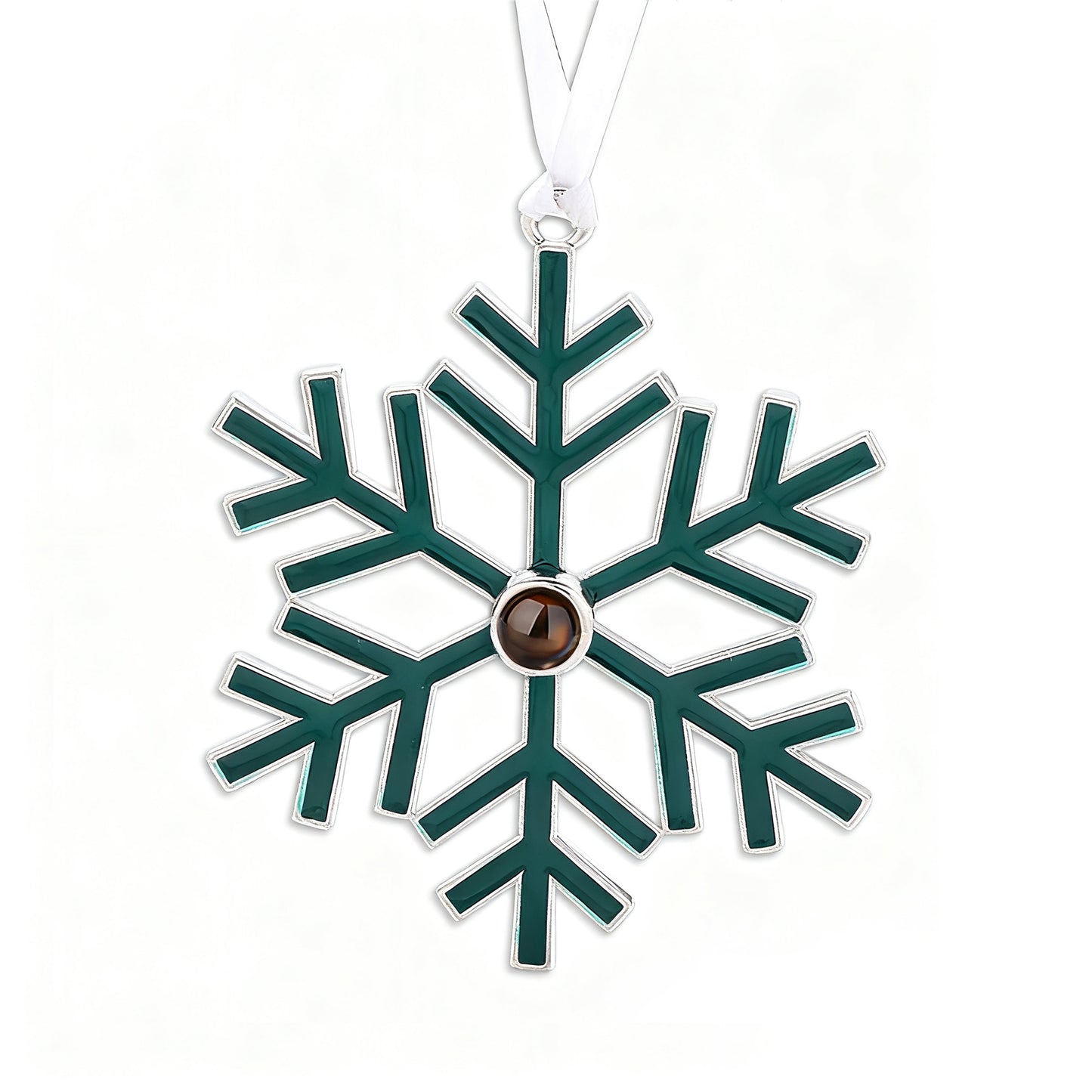 Green snowflake-shaped ornament with a brown center on a white background