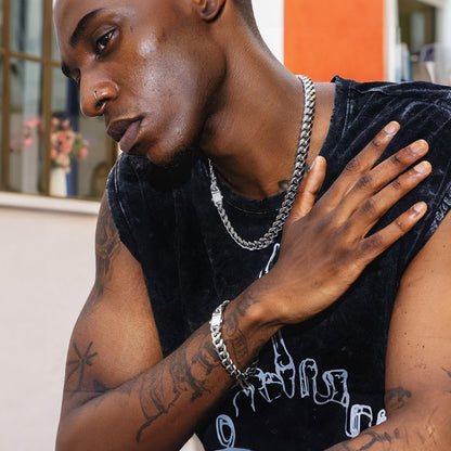 Male model wearing steel Miami Cuban chain and bracelet set
