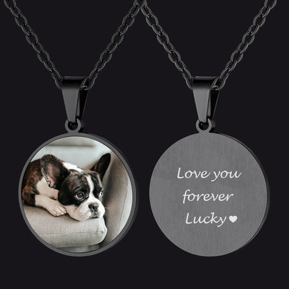 Necklace with a pendant featuring a dog's photo and engraved text on a black background