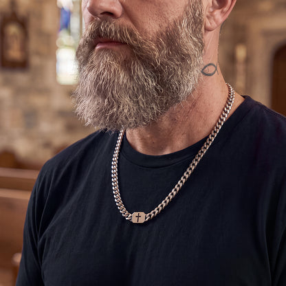 Man styling Bible verse cross Cuban chain with T-shirt