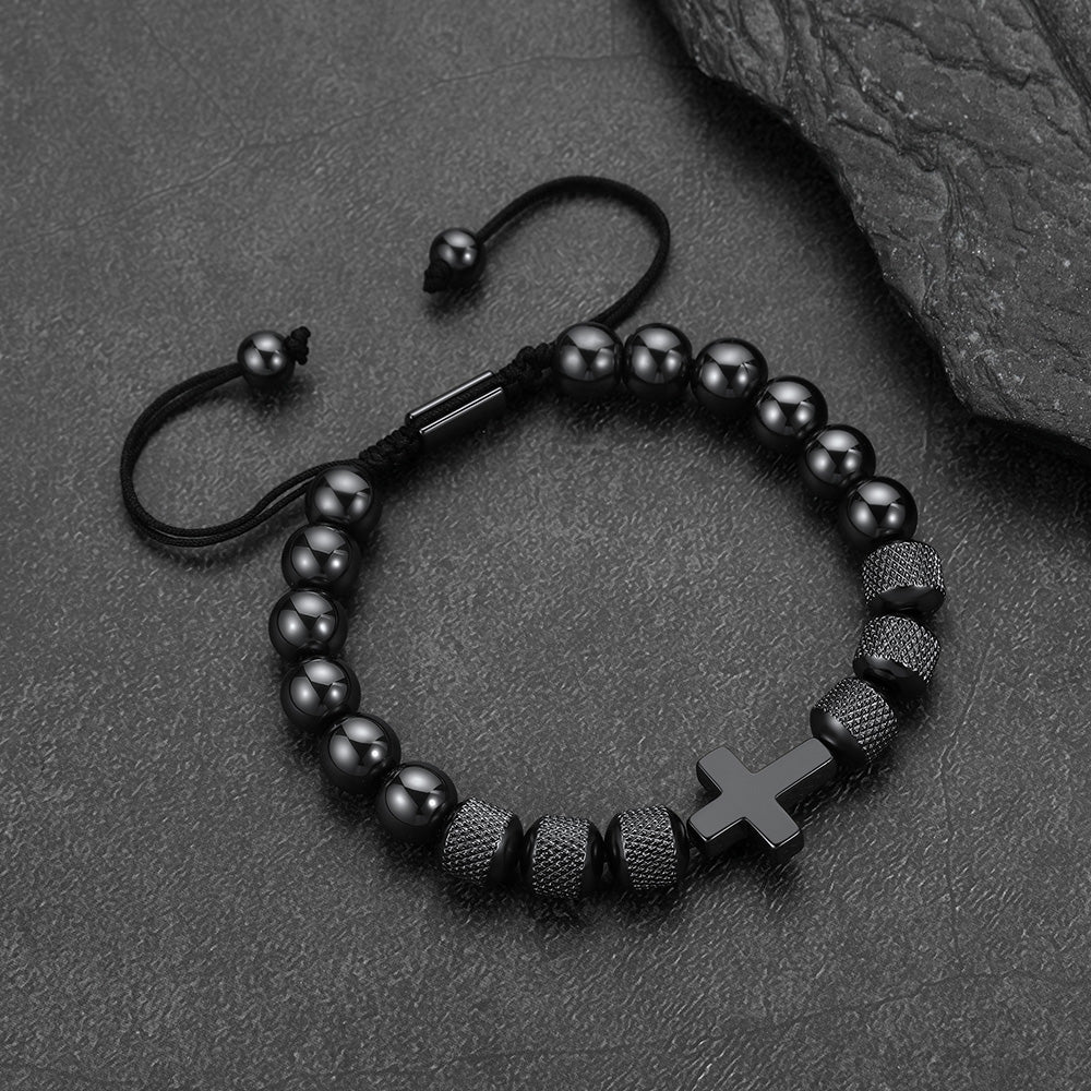 Close-up of black obsidian cross-shaped beads, detailed natural stone cross bracelet for men