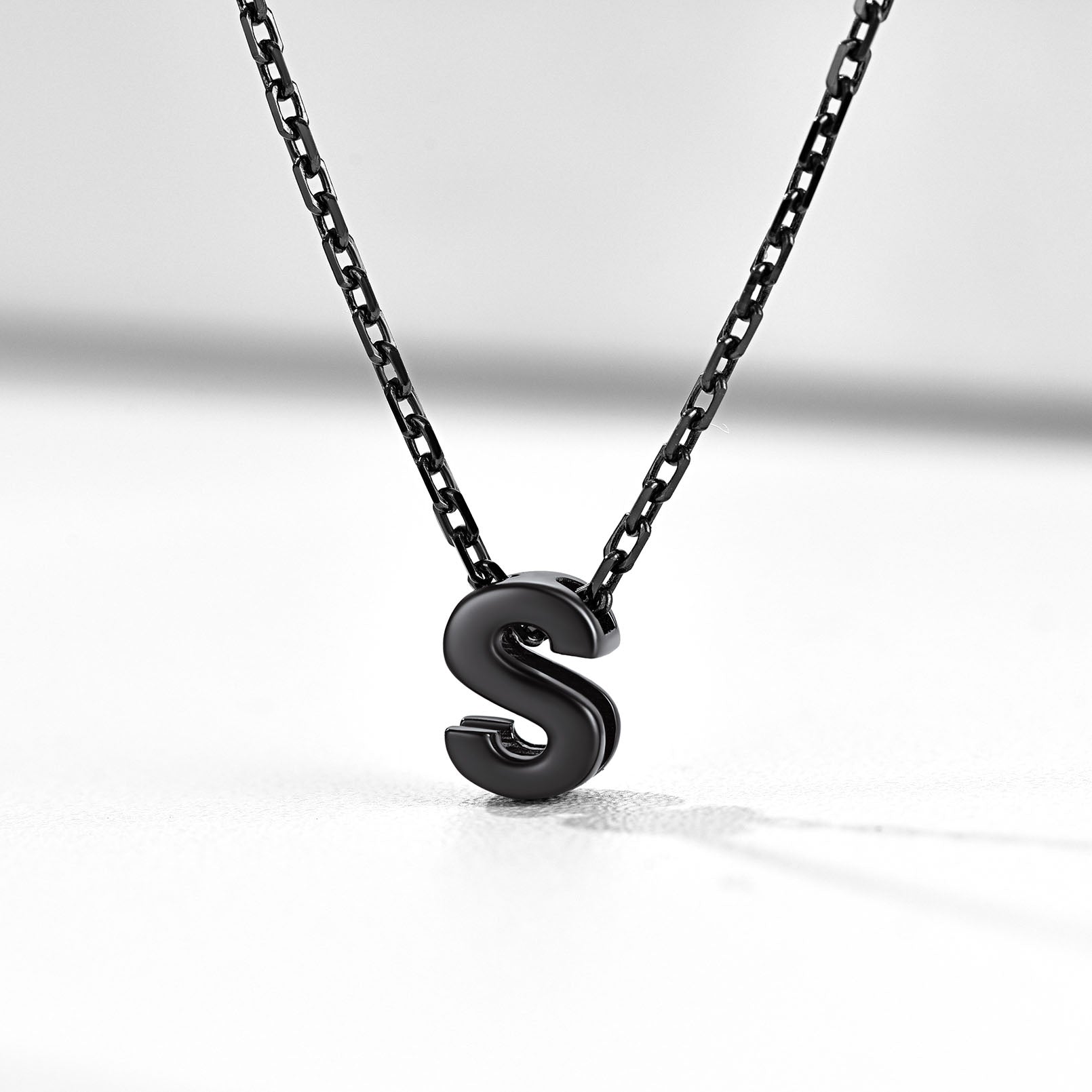 Black 'S' pendant necklace