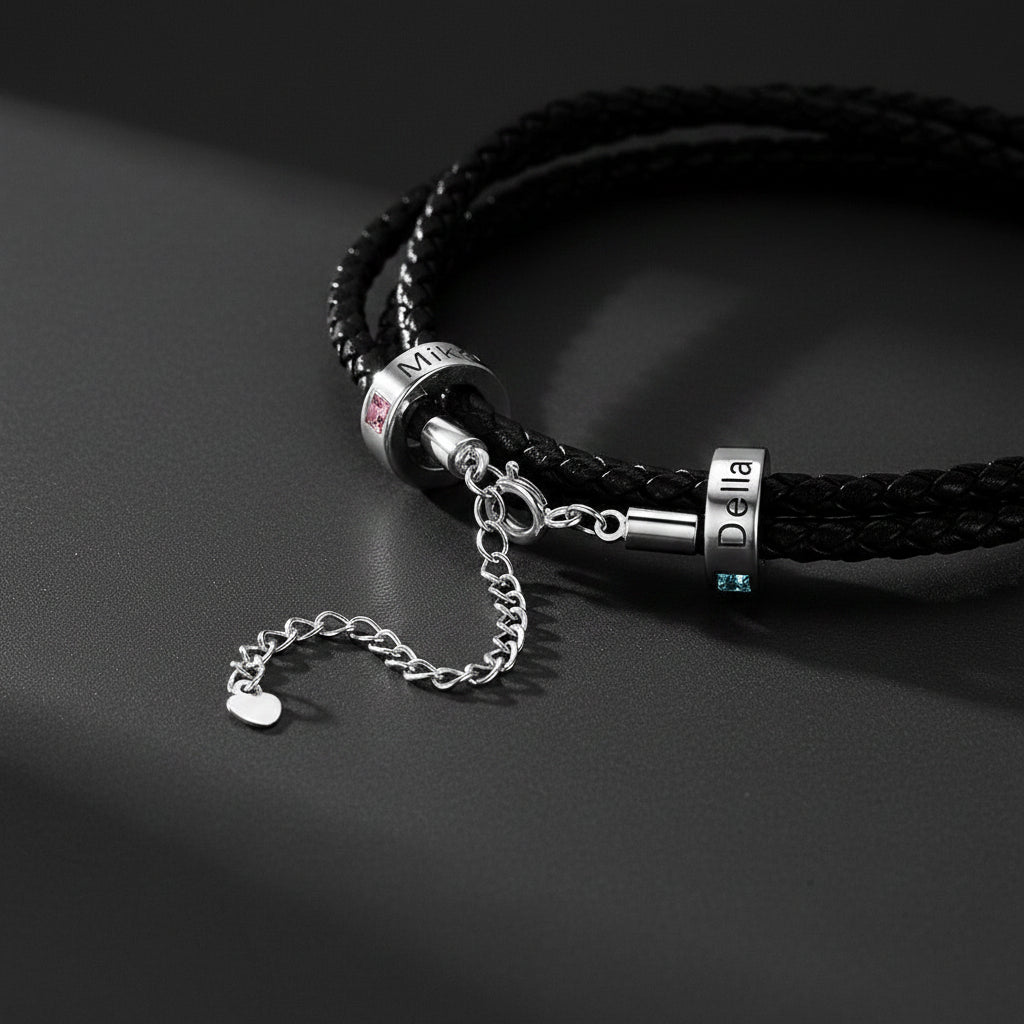 Black braided bracelet with silver charms