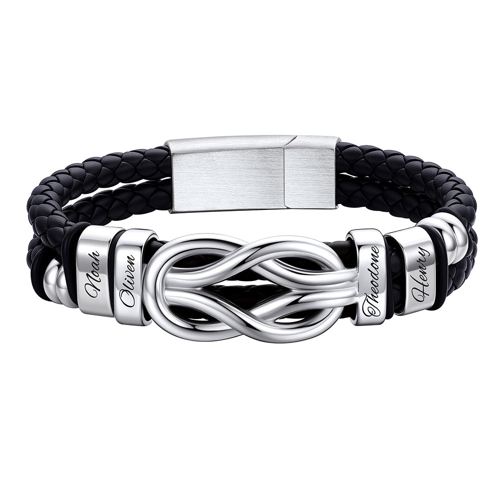 Black leather bracelet with silver infinity symbol and engraved names on a white background