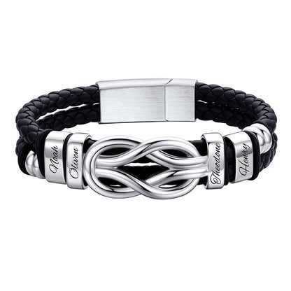 Black leather bracelet with silver infinity symbol and engraved names on a white background