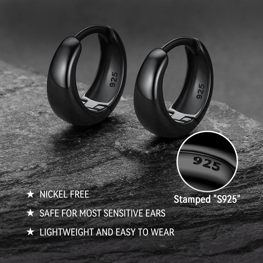 Black hoop earrings on a dark stone surface with '925' stamp details.
