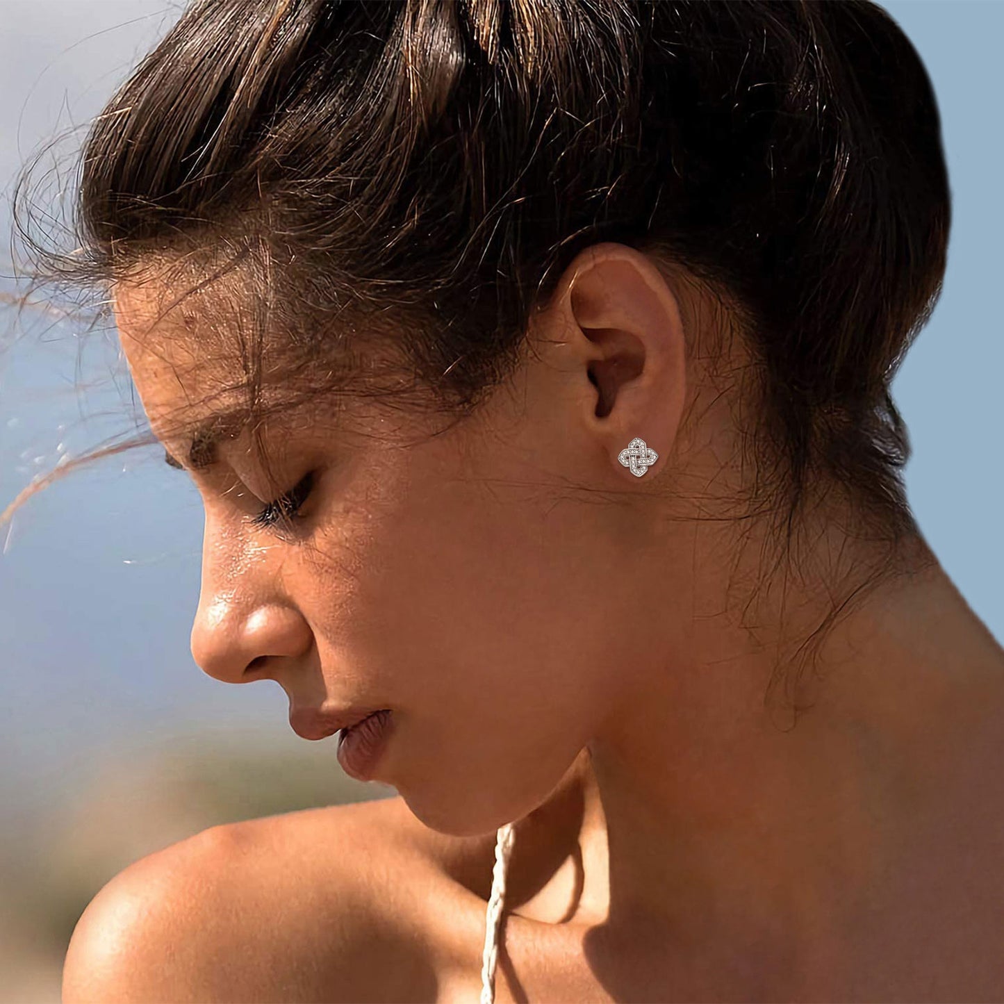 Woman wearing Celtic knot earrings in sterling silver