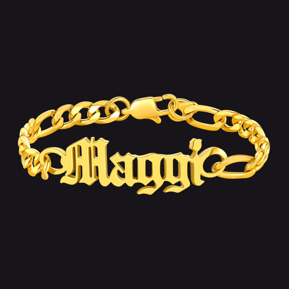Gold chain bracelet with 'Maggi' engraving on a black background