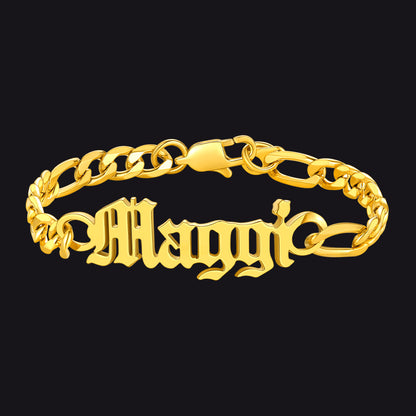 Gold chain bracelet with 'Maggi' engraving on a black background