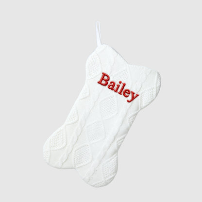 White Christmas stocking with 'Bailey' embroidered in red on a light gray background