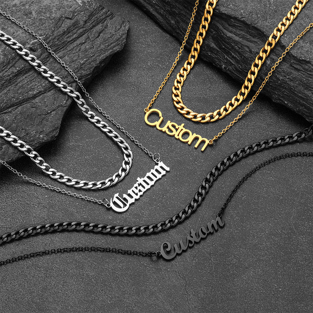 Collection of customizable chain necklaces on a dark stone surface