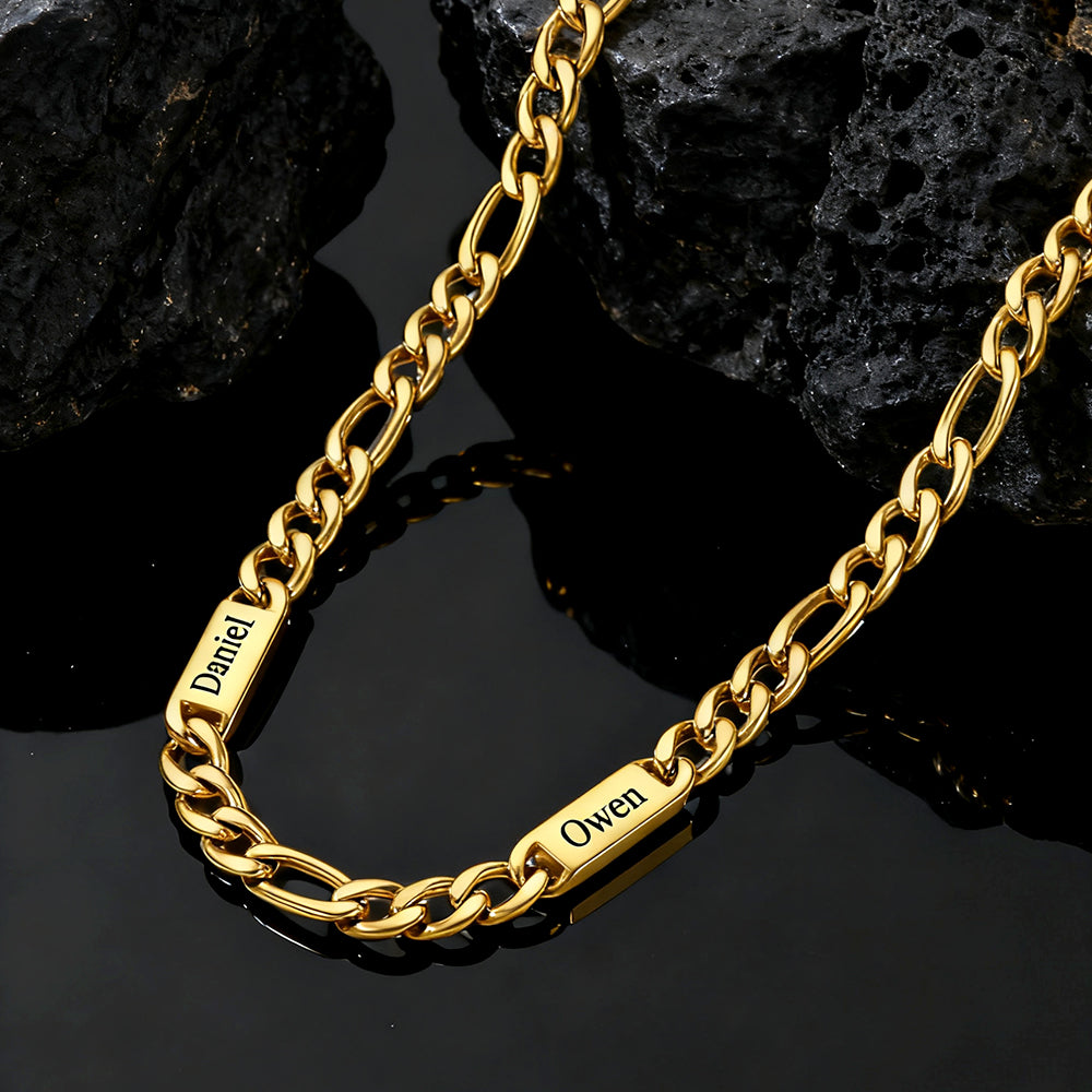 Gold name  chain with engraved names on a dark stone background