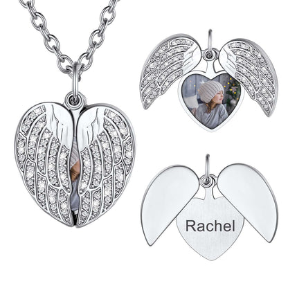 Silver angel wing necklace with heart pendant, engraved 'Rachel', and photo insert on a white background.