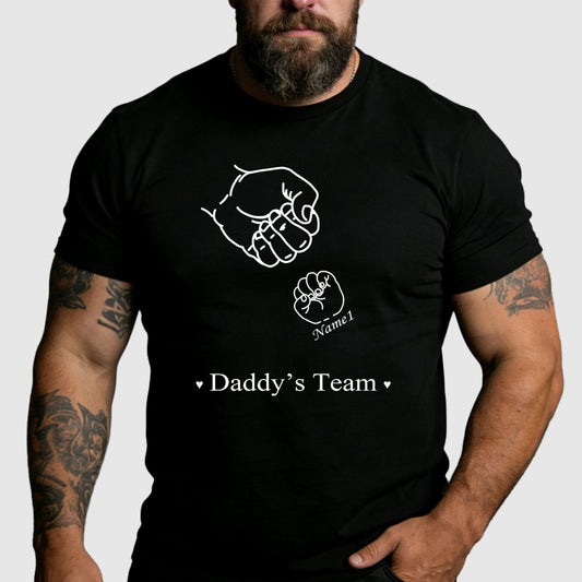 Man wearing a black t-shirt with a graphic design and text on a plain backgroundimg