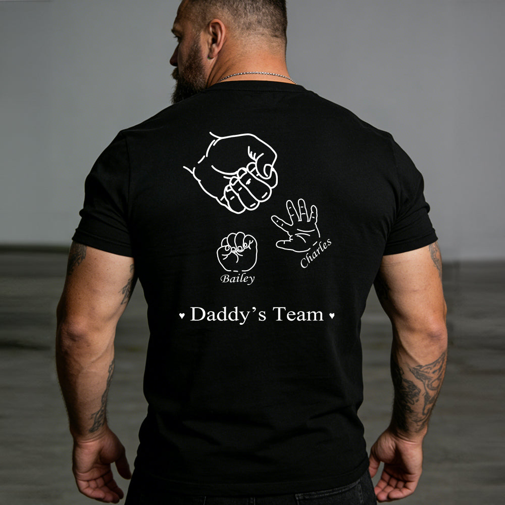 Man wearing a black t-shirt with white graphics and text on the back.