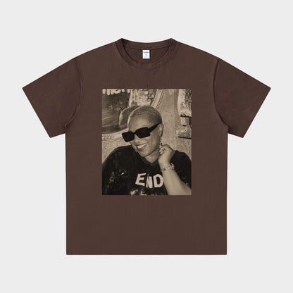 Brown t-shirt with a graphic of a person wearing sunglasses and a 'END' shirt on a white background