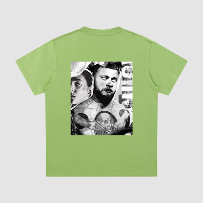 Green t-shirt with a graphic of a tattooed person on the back against a white background