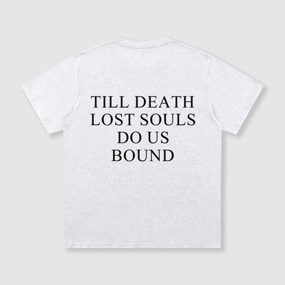 White t-shirt with black text 'TILL DEATH LOST SOULS DO US BOUND' on a light gray background