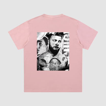 Pink t-shirt with a graphic design on the back against a light gray background