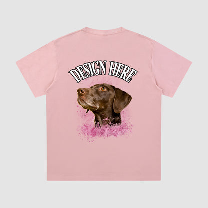 Pink t-shirt with a dog graphic and 'Design Here' text on a light gray background