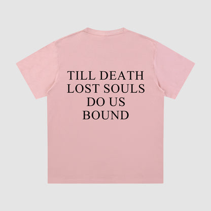 Pink t-shirt with black text on a light gray background