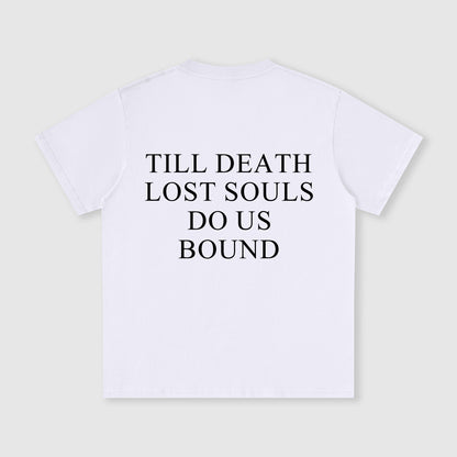 White t-shirt with black text 'TILL DEATH LOST SOULS DO US BOUND' on a light gray background