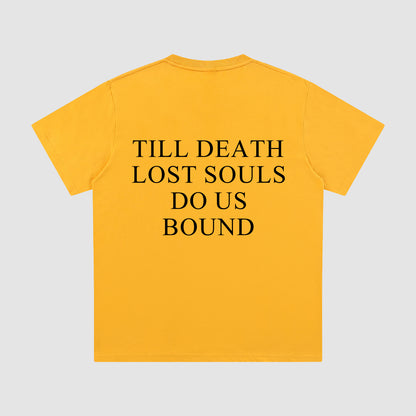 Yellow t-shirt with black text on a gray background